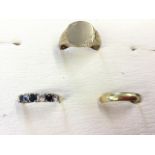 An 18ct gold wedding band; and a 9ct gold signet ring; and a 9ct gold sapphire & diamond claw set