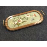 A rectangular rounded Victorian mahogany beadwork tray, the panel under glass worked with blossoms
