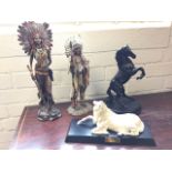 A Royal Doulton cast of a rearing horse on circular plinth; two resin cast Indian figures -