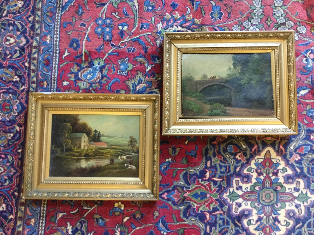 JB Russell, oils on boards, a pair, country river landscapes with figure with horse on bridge,