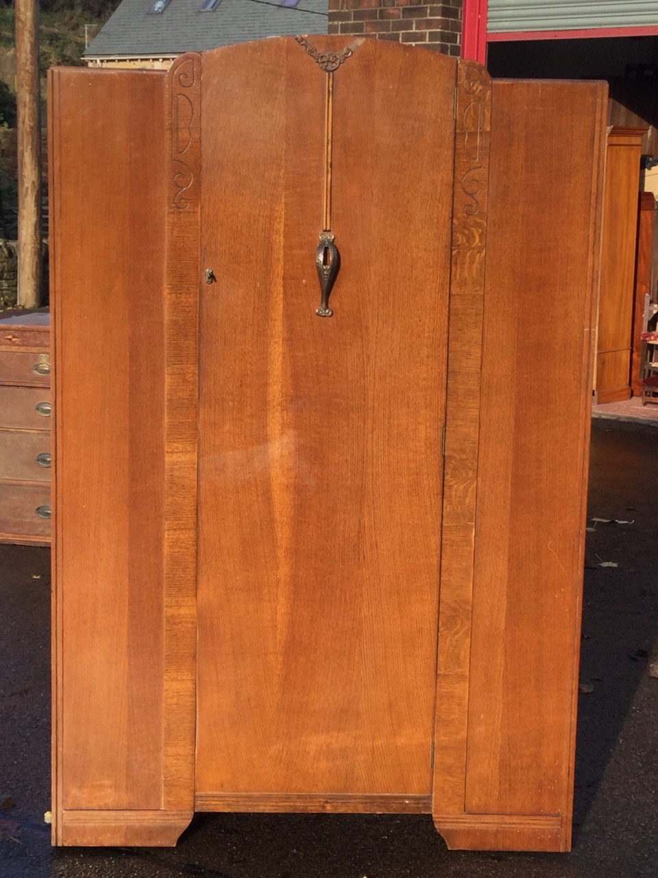 An oak wardrobe by Lawrencia, having arched door with press moulded floral decoration mounted with - Image 3 of 3