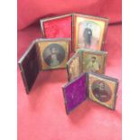 Four Victorian leather cased daguerreotypes, the hinged velvet lined cases with family portraits