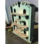 A wall mounting painted pigeon loft, the arched cabinet with eight arched apertures behind shaped