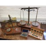 A set of Victorian brass postal scales by Hunt & Co of London, with brass weights on moulded oak
