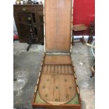 A Victorian mahogany bagatelle board, the cleated box with brass hinges & mounts having interior