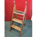 A set of Victorian pitch pine folding steps, with three treads and iron mounts.