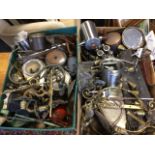 Two boxes of metal items including horse shoes, wall lights, oil cans, biscuit barrels, boxes,