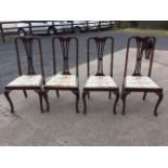 A set of four Edwardian Queen Anne style stained dining chairs, the backs with pierced waisted