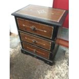 A mother-of-pearl inlaid dwarf chest with ebonised borders framing mahogany panels with chequered