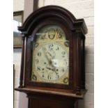 A nineteenth century mahogany longcase clock, the domed hood with moulded cornice above an arched