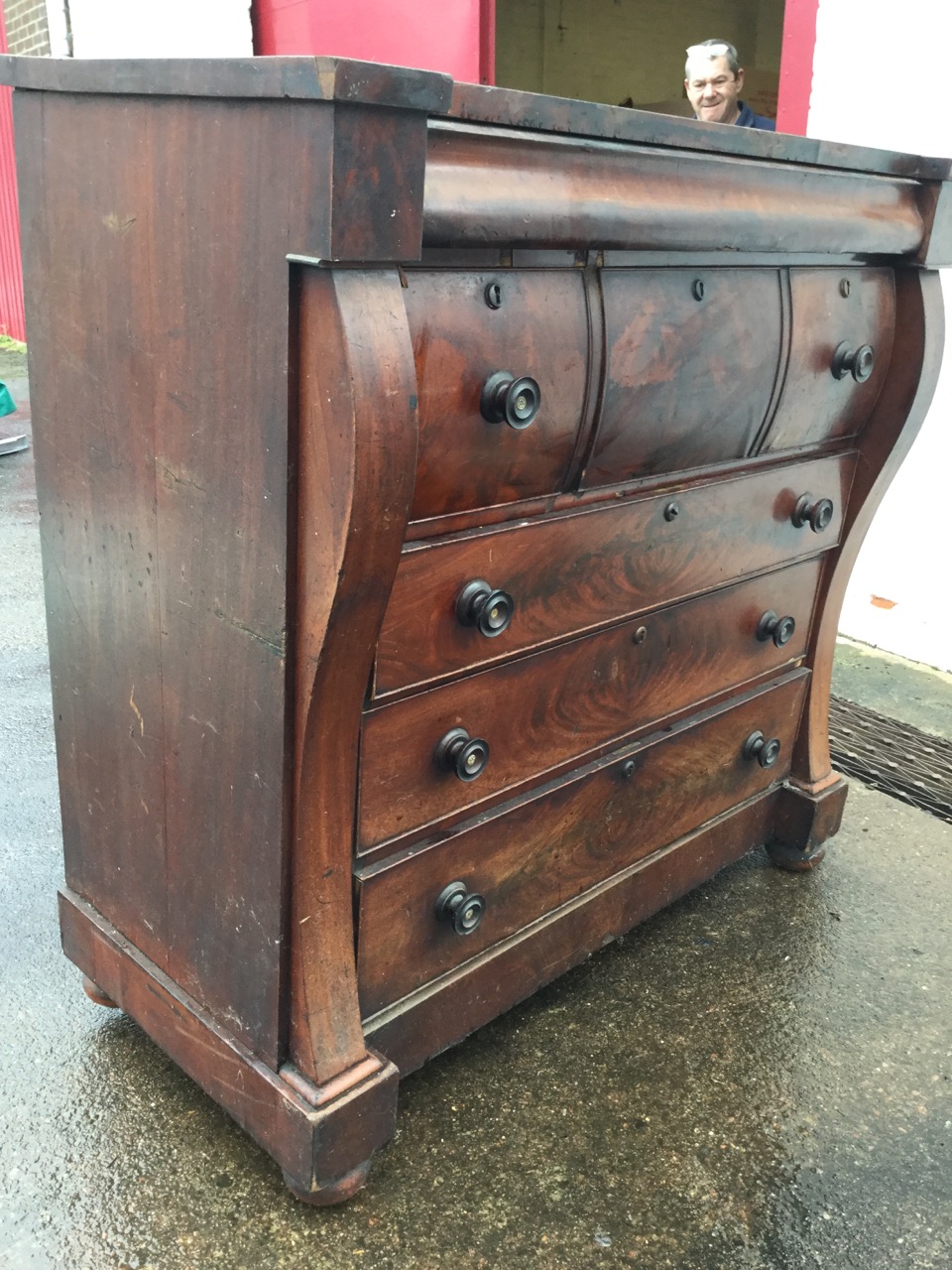 A Victorian mahogany chest of drawers, the top of inverted breakfront outline above a long cushion - Image 2 of 3