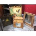 A pine bathroom cabinet with mirrored door cupboard beneath shelves; a pine framed dressing table