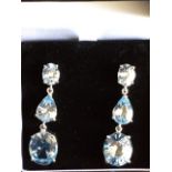 A cased pair of sterling silver, aquamarine & blue topaz drop earrings, the oval and teardrop shaped