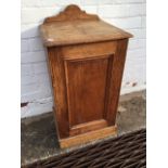 A late Victorian pine pot cupboard with aesthetic carved decoration to panelled door and upstand,