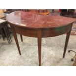 An antique D shaped mahogany hall table, with deep plain frieze raised on square tapering legs. (