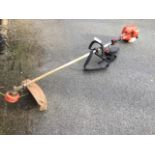 A Tanaka TBC-340 petrol garden strimmer.