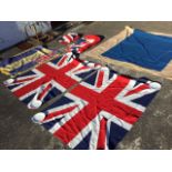 Four British Made 4ft 6in union jacks, the flags in mint condition; a fringed British Legion flag;