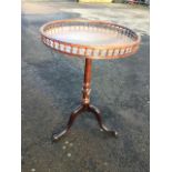 A nineteent century Chippendale style mahogany mahogany snap-top wine table, the circular tray top