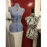 A lady bust manikin covered with zebra printed cotton, on ebonised stand with tripod legs; and an