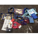 A load of masonic gear including leather aprons, sashes, books, a certificate, cuffs, some from West