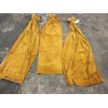 A set of three 5ft lined gold velour curtains. (60in) (3)