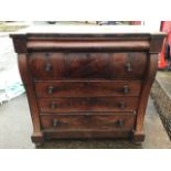 A Victorian mahogany chest of drawers, the top of inverted breakfront outline above a long cushion