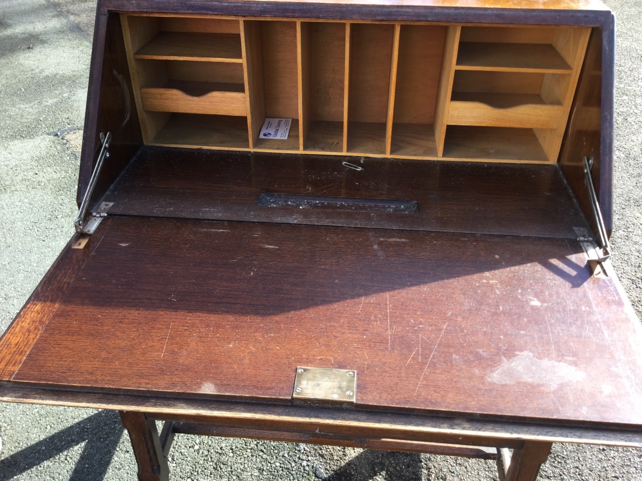 An oak bureau, the fallfront with routed panel enclosing a fitted interior of pigeonholes, having - Image 2 of 3