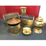 Miscellaneous brass: two magazine racks, a tubular embossed stickstand, an urn, a coal bin &