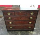 A nineteenth century mahogany boxwood strung chest of drawers, with three frieze drawers above three