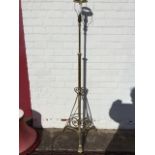 A Victorian telescopic brass oil lamp stand, converted to a standard lamp with shade, the column