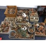 Eight wood crates and boxes full of fir cones, buckets with swing handles, candleholders, ornaments,