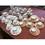 A late Victorian Staffordshire “poor mans Derby” 12-piece teaset decorated with floral bands; an