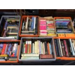 Seven boxes of general books including reference, novels, biographies, travel, art, some DVDs, OS