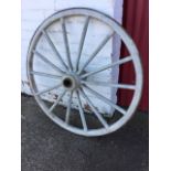 A painted Victorian ash cartwheel with iron rim, having oval spokes around a central hub. (42in)