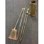 A set of Victorian steel fire irons with Adams style brass urn handles cast with swagged drapery -