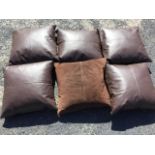 A set of six 2ft leather cushions with suede backs. (6)