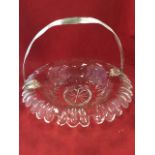An early nineteenth century cut glass fruit basket dish, with overhanging fluted rim framing facet