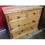 A Victorian style pine chest of drawers, with rectangular top above two short and two long