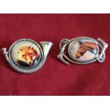 A silver hunting brooch with circular enamelled panel of a fox framed by horn, having hook and