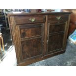 A stained Edwardian dresser, the rectangular moulded top above two frieze drawers and panelled
