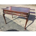 An eighteenth century mahogany silver table, the rectangular tray top with cut corners above a