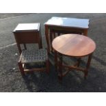 An oak box stool with hinged lid; a circular coffee table on square fluted legs joined by cross