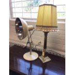 A 50s Radiary lamp by Hinders with reflecting metal shade on adjustable column with circular base;