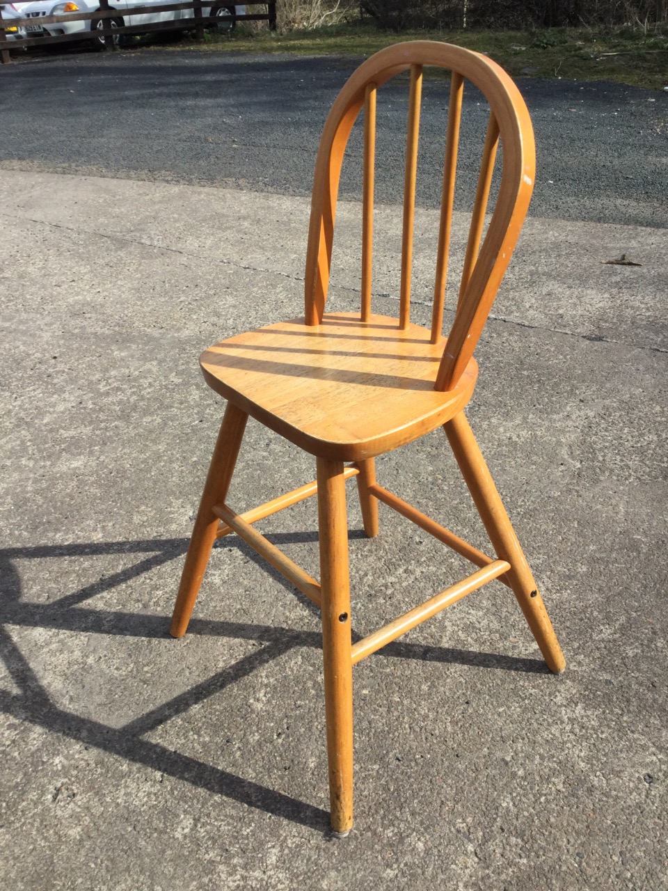 A leather upholstered chair with brass studding, the back rail carved with a flowerhead, raised on - Image 3 of 3