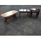 A nest of four Gplan mahogany coffee tables, the moulded crossbanded tops above fluted friezes,