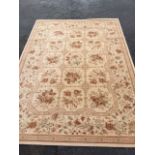 A Belgian Zenith rug woven with floral grid of fifteen panels framed by frieze of linked foliage,