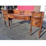 A George IV Scottish mahogany sideboard, the bowfronted centre section with long frieze drawer