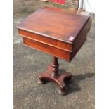 A Victorian mahogany desk with moulded hinged slope enclosing an interior with pigeonholes above a