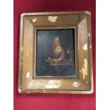 Early nineteenth century oil on oak board, interior scene with lady at table with needlework by