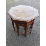 A North African bone inlaid octagonal coffee table, the top with circular medallion bordered by